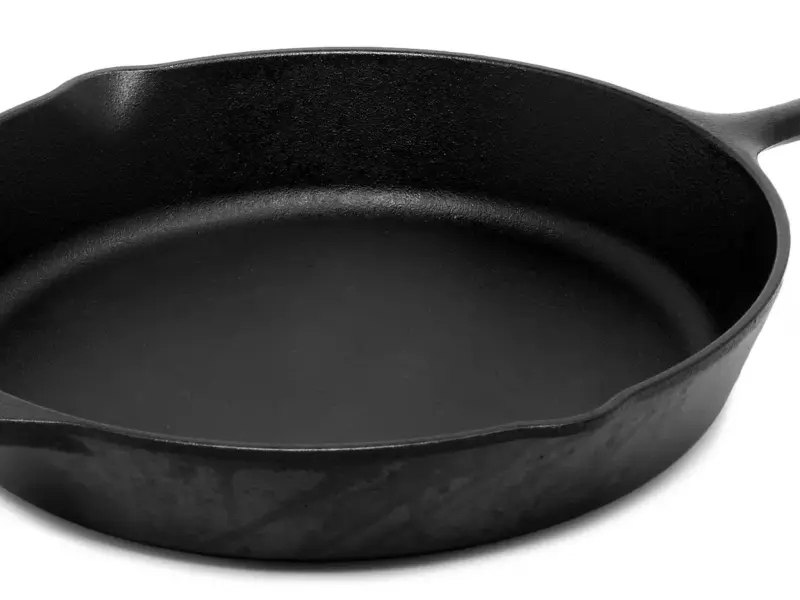 A black cast iron frying pan seen from above.
