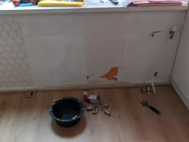 A central heating radiator fitted beneath a window in a domestic room.