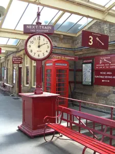 A clock on a railway station platform.