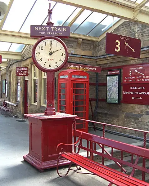 A clock on a railway station platform.